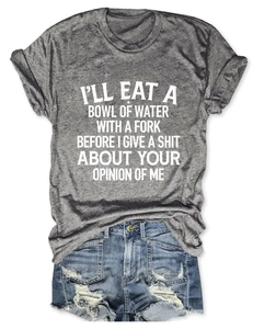 Close-up of grey graphic t-shirt and distressed blue denim shorts flat lay set