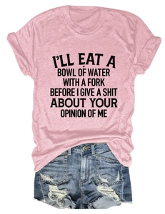 Pink T-shirt with black text print paired with distressed denim shorts on white background