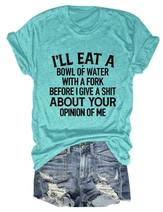 Flat lay of a turquoise graphic t-shirt with slogan and distressed denim shorts