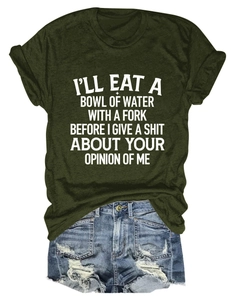 Flat lay of an olive green crew neck T-shirt with text and ripped denim shorts