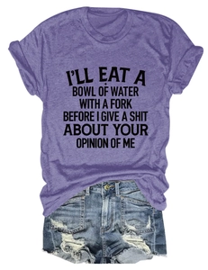 Flat lay of purple crewneck T-shirt with black text and distressed blue denim shorts