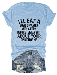 Detail of light blue cotton T-shirt with black text slogan and frayed denim shorts