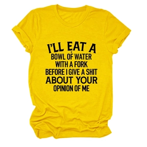 Detail of soft cotton yellow t-shirt showing black bold printed street graffiti slogan
