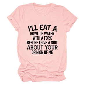 Close-up of pink crew neck cotton t-shirt with bold black slogan print and rolled sleeve hem