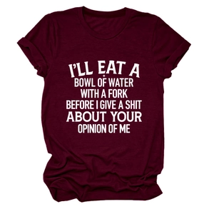 Close-up of white slogan print on a wine red cotton crew neck short sleeve t-shirt