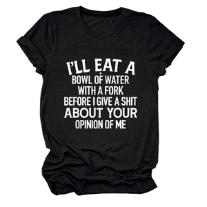 Close-up of white slogan print and rolled sleeve detail on a black cotton t-shirt