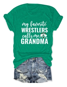 Vue détaillée du tissu du T-shirt vert et de l'imprimé graphique My Favorite Wrestlers