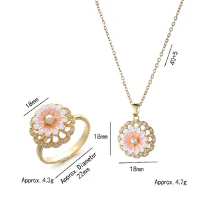 Golden flower jewelry set with pink enamel petals and pearl center for women