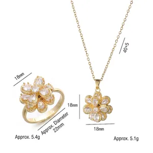 Golden flower jewelry set with sparkling zircon stones including rotating ring and necklace
