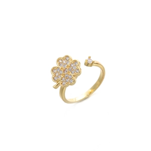Minimalist gold clover ring with sparkling crystals on a clean white background