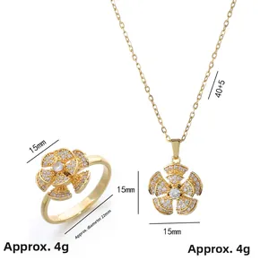 Golden camellia flower jewelry set featuring rotating ring and pendant necklace with zircons