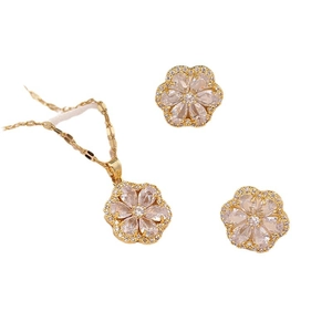 Elegant gold flower jewelry set with heart-shaped zircon necklace and matching earrings