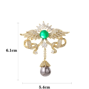 Vintage Brosche Engelsflügel mit grünem Edelstein, Strass und grauer Perle