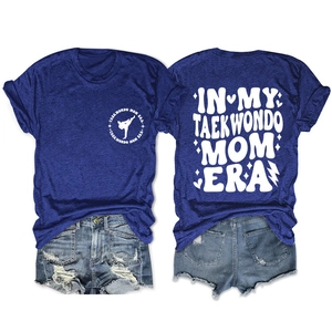 Front and back view of heather blue Taekwondo Mom Era graphic tee on white background