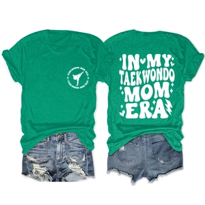 Detailed front and back view of In My Taekwondo Mom Era green cotton blend t-shirt