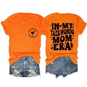 Orange In My Taekwondo Mom Era T-shirt paired with denim shorts, front and back view