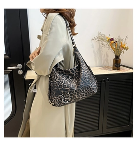Detailed view of large leopard print hobo bag with adjustable strap and spacious design