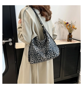 Leopard print hobo bag with large capacity shown in a stylish home setting