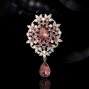 Vintage palace style brooch with pink pear-shaped crystal and sparkling rhinestones