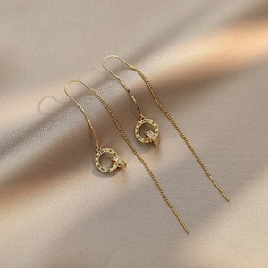 Elegant gold chain drop earrings with Roman numeral rings and sparkling zircon crystals