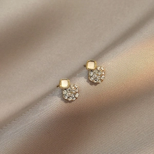 Elegant gold square stud earrings with white opal and pavé diamonds on satin fabric
