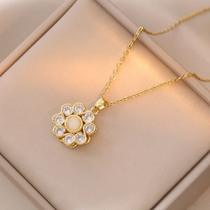 Elegant gold spinning flower pendant necklace with opal center and zircon stones