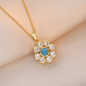 Rotating floral pendant necklace with blue cat eye stone and zircons in gold finish