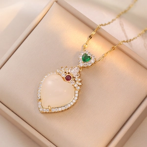 Elegant emerald green heart pendant necklace with white stone and gold chain plating