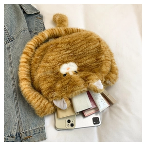 Detail view of plush orange cat crossbody bag showing internal capacity for cosmetics