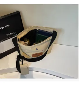 Top view of cream canvas tote bag interior showing large capacity for tablet and water bottle