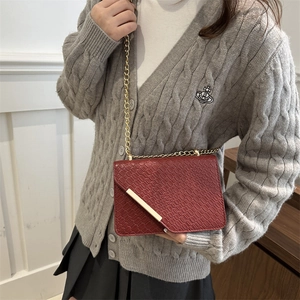Red crocodile texture chain bag with gold metal trim and flap closure for women