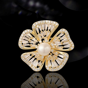 Elegant gold flower brooch with freshwater pearl and sparkling cubic zirconia stones