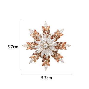 Golden snowflake brooch with amber and white stones, 5.7cm diameter, elegant jewelry