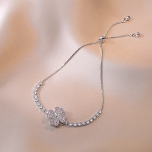 Detail of adjustable clover bracelet with pink pave stones and sparkling zircons