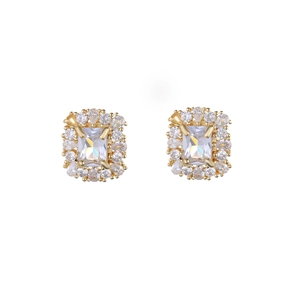 Detail of square zircon stud earrings with crystal halo in gold-plated setting