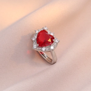 Elegant heart-shaped red zircon ring with halo crystals on silver metallic band