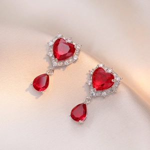 Elegant silver earrings set with heart-shaped red zircon and pear-shaped drop pendants