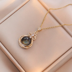 Golden titanium steel necklace with temperature-sensitive zircon flower pendant in a gift box