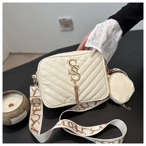 Quilted crossbody camera bag in cream with wide jacquard strap and round coin purse