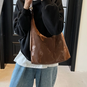 Glossy brown minimalist hobo bag for women with an adjustable shoulder strap and large capacity
