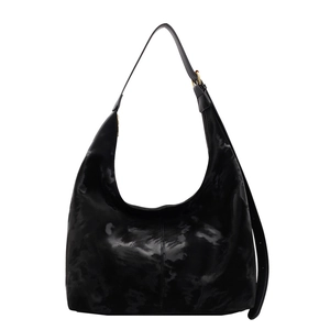 Black large hobo bag with marble texture and adjustable shoulder strap on white background