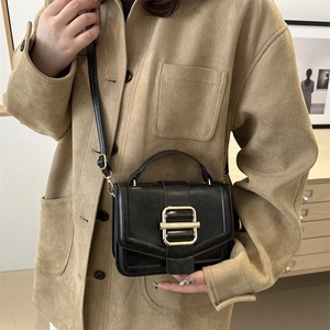 Classic black leather vintage crossbody flap bag with elegant gold metal buckle closure