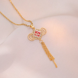 Gold Chinese knot necklace with red Fu character pendant and crystal tassel details