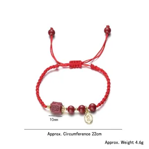 Handmade woven red string bracelet with 10mm cinnabar beads and gold Fu pendant charm