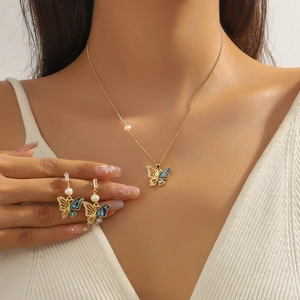 Elegant butterfly jewelry set with pearl necklace and drop earrings in 18K gold finish