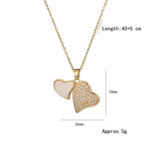 Gold double heart pendant necklace with white enamel and pavé zircon stones on chain