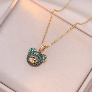 Chic gold-plated bear pendant necklace with green and black zircons in a jewelry box