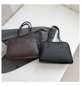 Detailed comparison of coffee and black leather tote bags with front pockets and zippers
