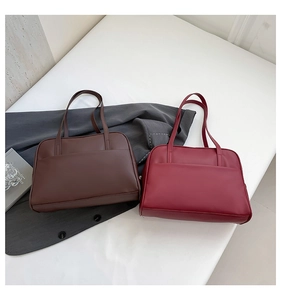 Detailed top view of dark coffee and wine red PU leather tote bags with front pockets
