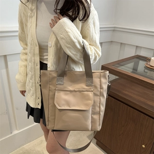 Beige large capacity nylon tote bag with front pocket and adjustable strap for women